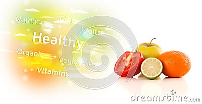 Colorful juicy fruits with healthy text and signs Stock Photo