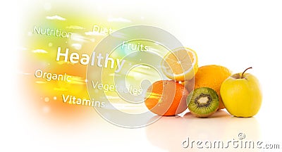 Colorful juicy fruits with healthy text and signs Stock Photo