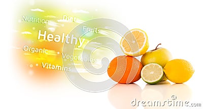 Colorful juicy fruits with healthy text and signs Stock Photo