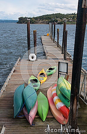 Colorful kayaks ondock Coupeville WA Stock Photo