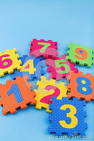 Colorful kids numbers toys on blue background Stock Photo