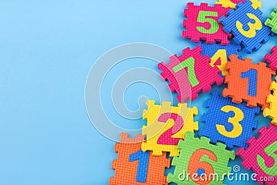 Colorful kids numbers toys on blue background Stock Photo