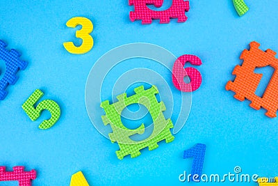 Colorful kids numbers toys on blue background Stock Photo