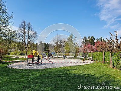 Colorful kids toys and playground equipment is abandoned because of lockdown. Stock Photo