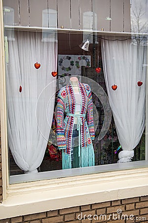 A colorful knitted coast surrounded by hearts on a street in a store of clothing store in Douglasville Georgia Editorial Stock Photo