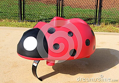 Colorful Ladybug Bouncy Toy on Childrens Playground Stock Photo