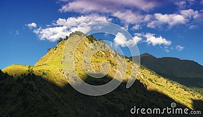 Colorful landscape with high Himalayan mountains, green forest Stock Photo