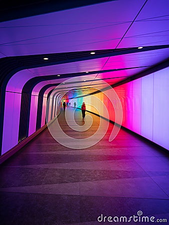 Colorful LED lights art wall tunnel underground subway underpass in Kings Cross St Pancras train station London GB UK Editorial Stock Photo