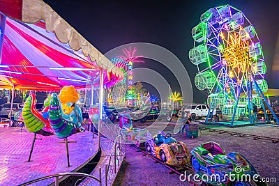 Colorful lights in the outdoor amusement park at night, the Temple fair is an annual traditional festival, Editorial Stock Photo