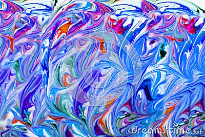 Colorful liquid paints mixed together creating modern abstract Stock Photo