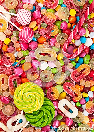 Colorful lollipops and different colored candies Stock Photo