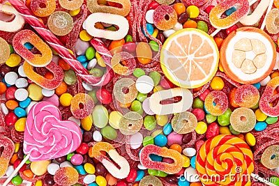 Colorful lollipops and different colored candies Stock Photo