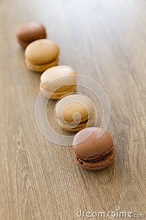 Colorful macarons in brown and earth colors. Sweet French cakes Stock Photo