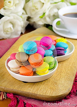 Colorful macarons on white plate Stock Photo