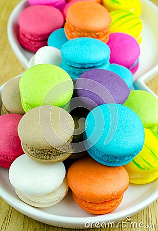 Colorful macarons on white plate Stock Photo