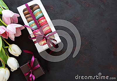 Colorful macaroons and tulips Stock Photo