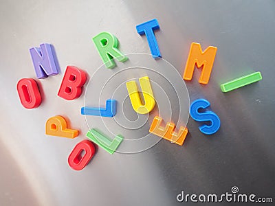 Colorful magnetic letters Stock Photo