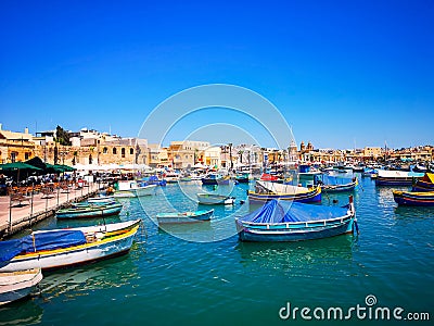 Colorful Marsaxlokk bay with fisher boats at Malta Editorial Stock Photo