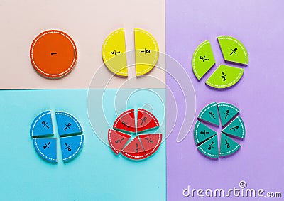 Colorful math fractions on the pink blue violet bright backgrounds. Interesting math for kids. Education, back to school concept. Stock Photo