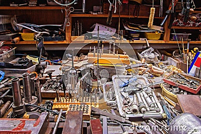 Colorful mess with various tools on a smith table Stock Photo