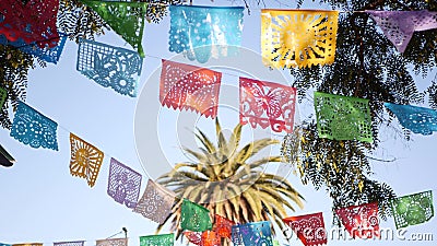 Colorful mexican perforated papel picado banner, festival colourful paper garland. Multi colored hispanic folk carved tissue flags Stock Photo