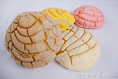 Colorful Mexican sweet bread on a white table Stock Photo