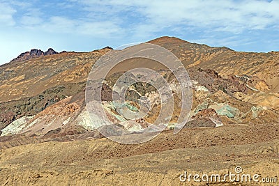 Colorful Mineral Deposits in a Desert Hill Stock Photo