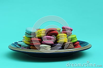 Colorful of mini macaroon cookie dessert food on blue lights backgrounds Stock Photo