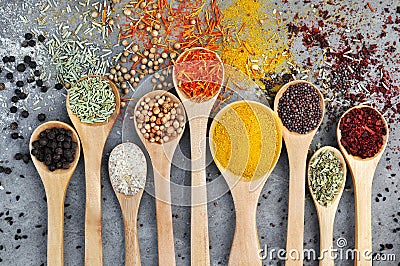 Colorful mix of herb and spice varieties: curry, coriander, turmeric, cumin, paprika, pepper, mustard, salt, thyme, cardamon, oreg Stock Photo