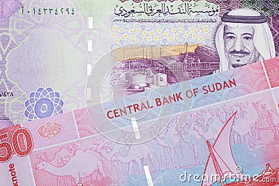 Colorful money from Sudan with money from Saudi Arabia Stock Photo