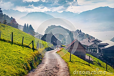 Colorful morning view of Stansstad village, Switzerland, Europe. Foggy autumn scene of Lucerne lake. Nice landscape of Swiss Alp Stock Photo