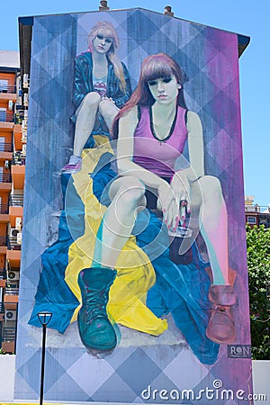 Girls painted on walls of multiple family dwelling in La Boca, Buenos Aires, Argentina Editorial Stock Photo