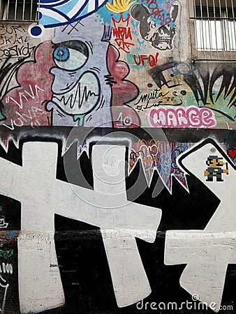 Colorful mural of street art about names, cartoons, and modern concepts in art Editorial Stock Photo