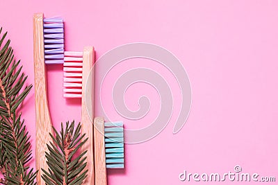 Colorful natural bamboo brushes on pink background Stock Photo