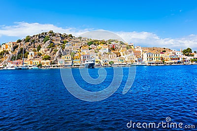 Colorful neoclassical houses in harbor town of Symi Symi Island, Greece Stock Photo