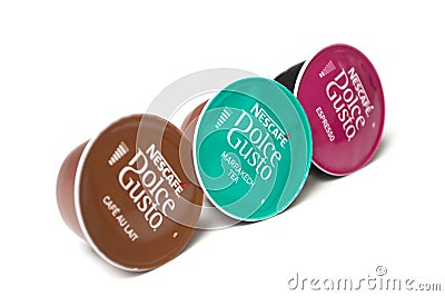 Colorful Nescafe expresso and tea capsules, the famous french brand of coffee dose on white background Editorial Stock Photo