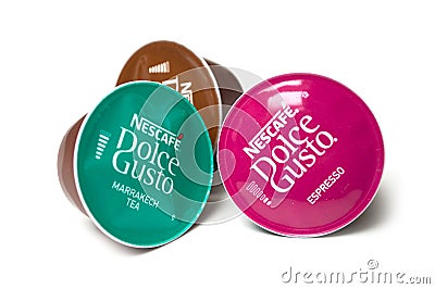 Colorful Nescafe expresso and tea capsules, the famous french brand of coffee dose on white background Editorial Stock Photo