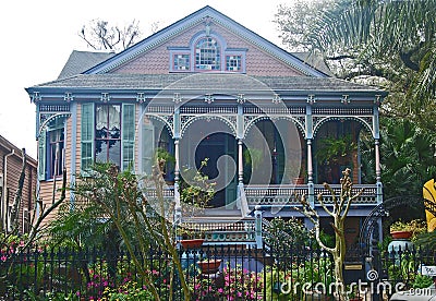 Colorful New Orleans house painted in pink and Caribean blue Editorial Stock Photo