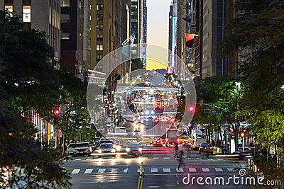 Colorful night lights of a busy scene on 42nd Street in New York City Editorial Stock Photo