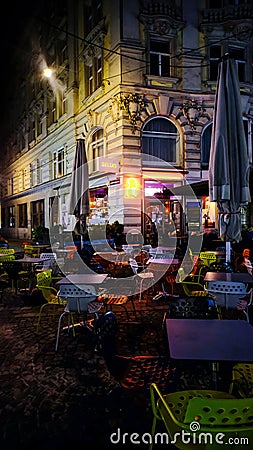 Colorful Nightlight Outdoor Restaurant Seating Area In Downtown Vienna, Austria Stock Photo