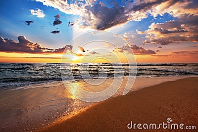 Colorful ocean beach sunrise. Stock Photo
