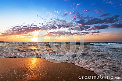 Colorful ocean beach sunrise. Stock Photo