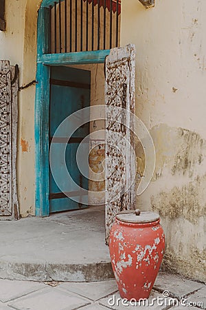 Colorful old doorway, pot and walls from the former prison on Prison Island (Changuu Island) Zanzibar Tanzania Africa Stock Photo