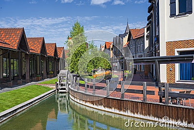 Colorful old town in Europe with channel and decorative water mill Stock Photo