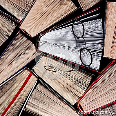 Colorful open books goy to reading stand on the shelf of the home library Stock Photo