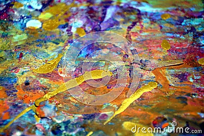 Colorful orange yellow purple gold paint splashes, colorful vivid waxy colors, contrasts creative background Stock Photo