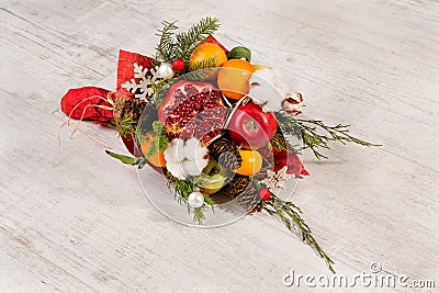 Colorful original bouquet of fruits and flowers. Stock Photo