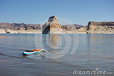 A colorful paddle board ready to be used at Lake Powell in the summertime Editorial Stock Photo