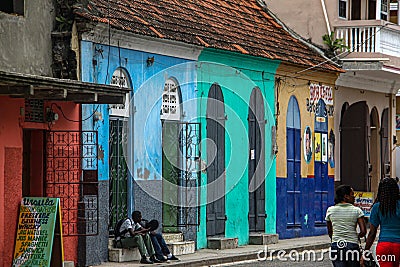 Colorful pain adorns the fronts of businesses and homes in Cap Haitien. Editorial Stock Photo