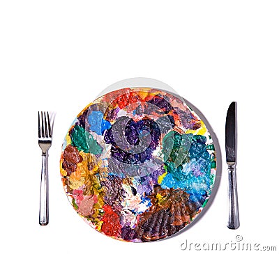 Colorful paint palette with fork and knife. Stock Photo